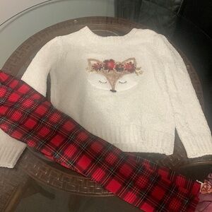 Red plaid pants with cream colored fox sweater